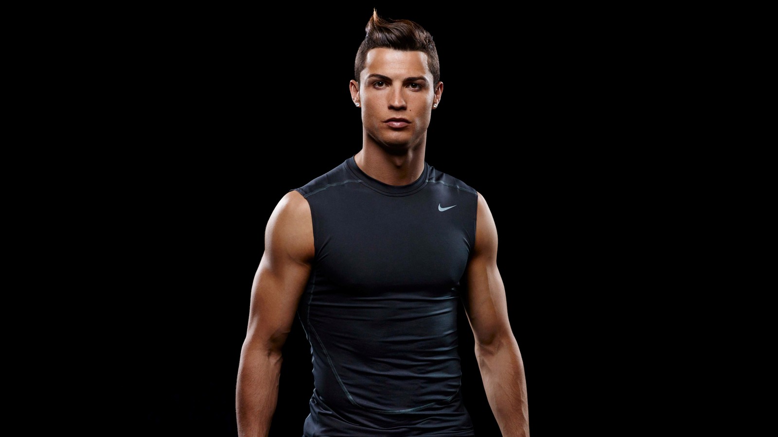 A close up of a man in a black shirt holding a tennis racquet (cristiano ronaldo, amoled, portuguese footballer, portugal football player, black background)