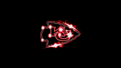 Logo des Kansas City Chiefs avec des effets scintillants sur fond noir