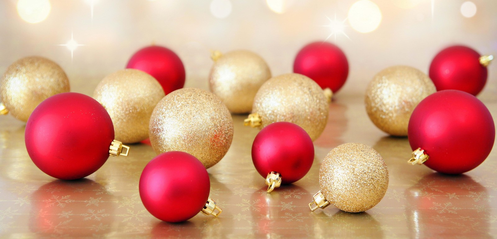 A close up of a bunch of red and gold christmas balls (christmas day, christmas ornament, christmas decoration, christmas, music)