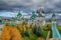 Stunning Cathedral Complex Surrounded by Autumn Foliage and Dramatic Sky