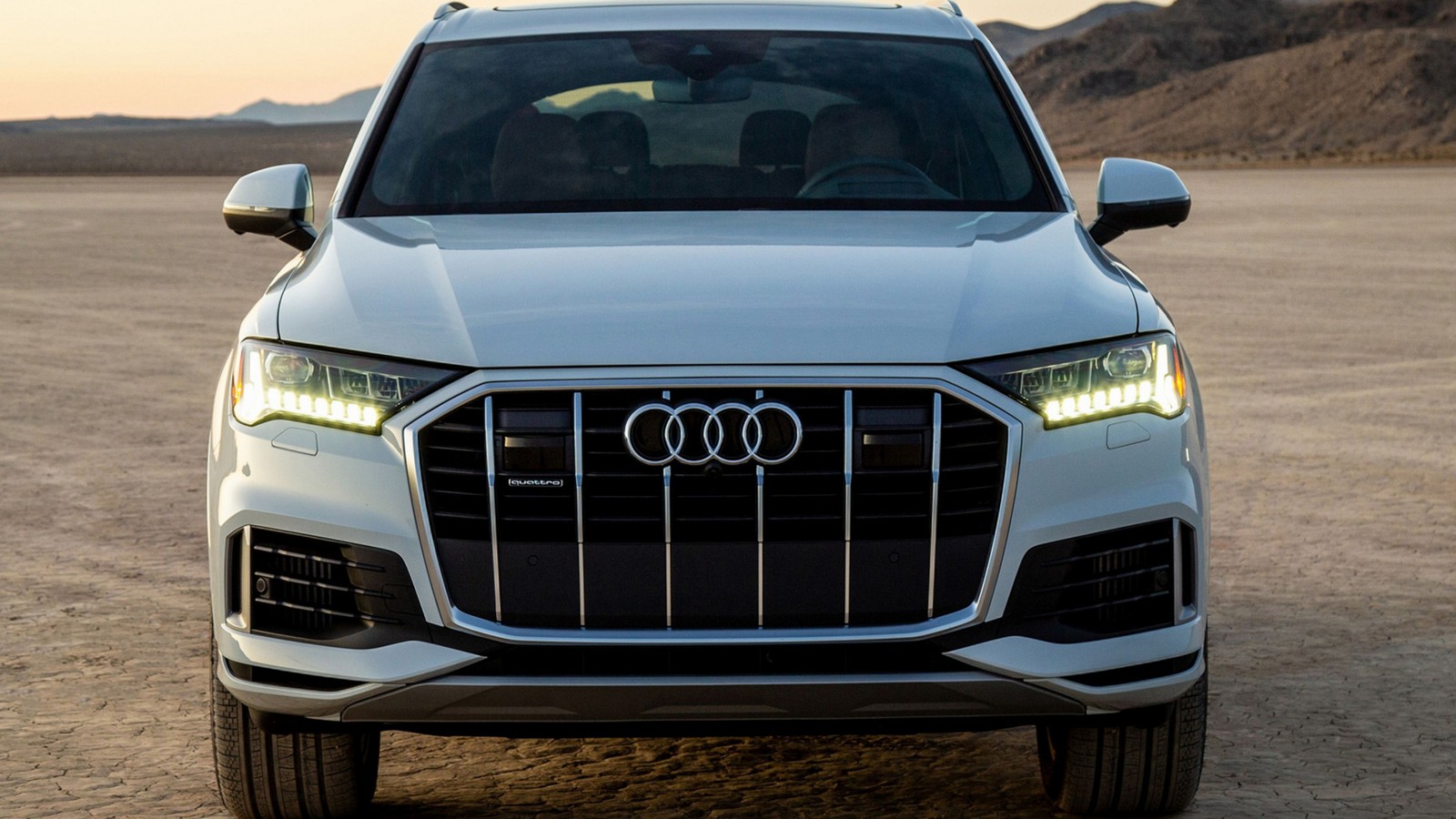 The front end of a white audi suv parked in a desert (audi rs7, audi, king, audi s4, automotive exterior)