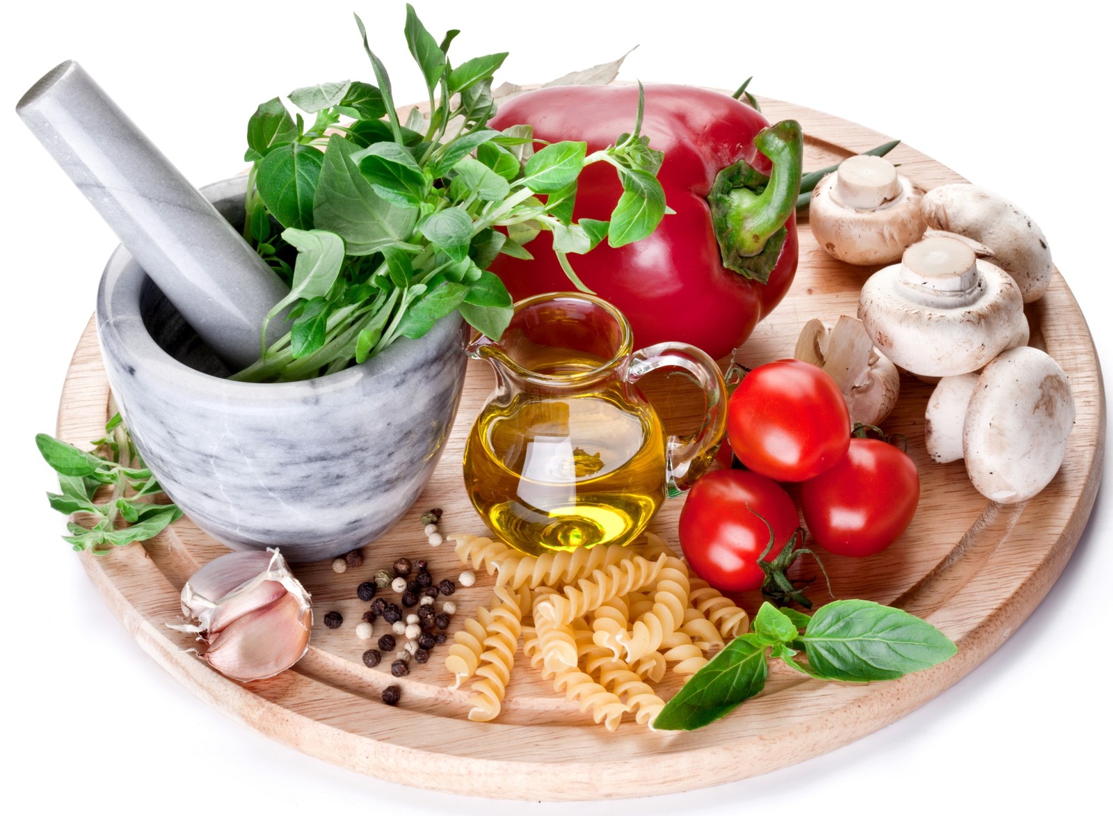 A close up of a plate of pasta, tomatoes, mushrooms, and a mortar (food, pasta, vegetable, tomato, natural foods)