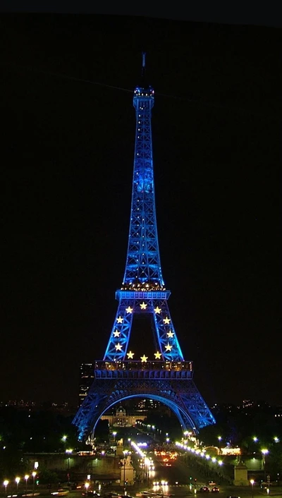 Eiffelturm in Blau mit Sternen bei Nacht beleuchtet