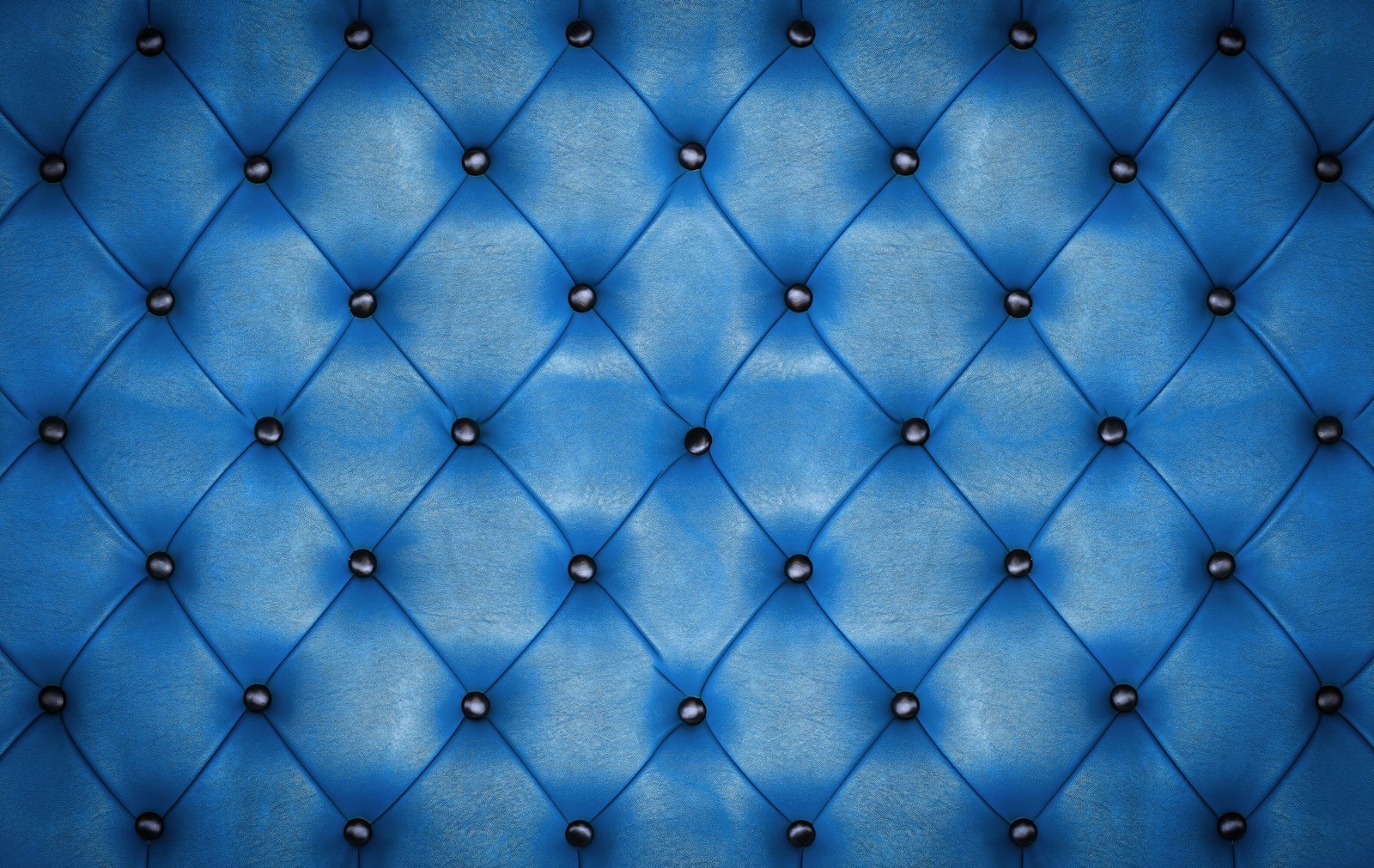 A blue leather upholstered with studding and rivets (texture, textile, blue, pattern, electric blue)