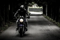 Urban Biker on a Dark Pathway: The Journey Awaits