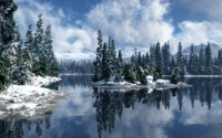 Tranquil Winter Reflection in a Snow-Covered Wilderness Lake