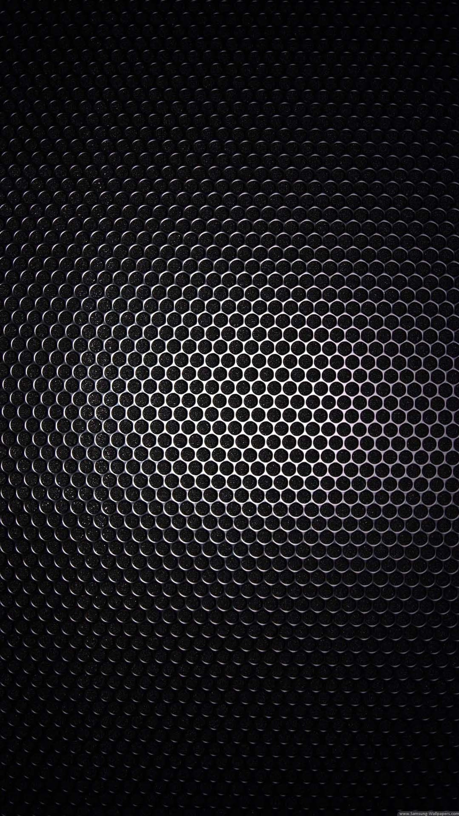 A close up of a metal surface with a black background (abstract, black)