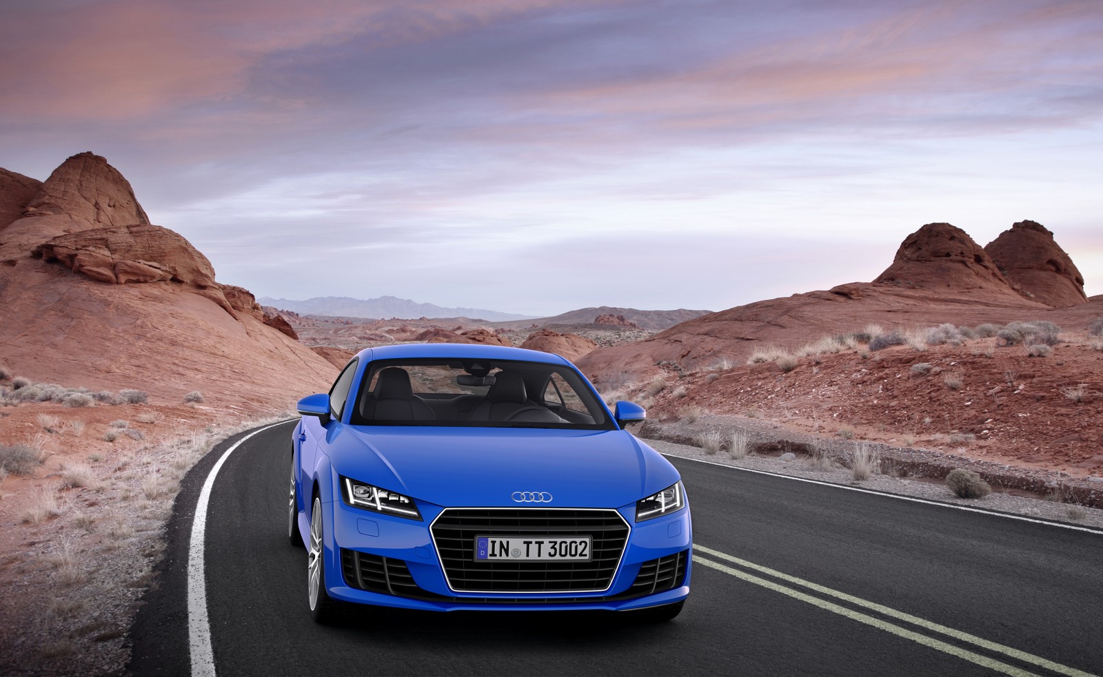 A blue audi car driving down a road in the desert (audi tt, car, sports car, audi, blue)