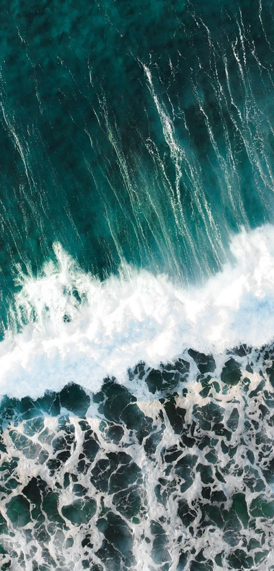 Azure Waves Embracing Rocky Shoreline