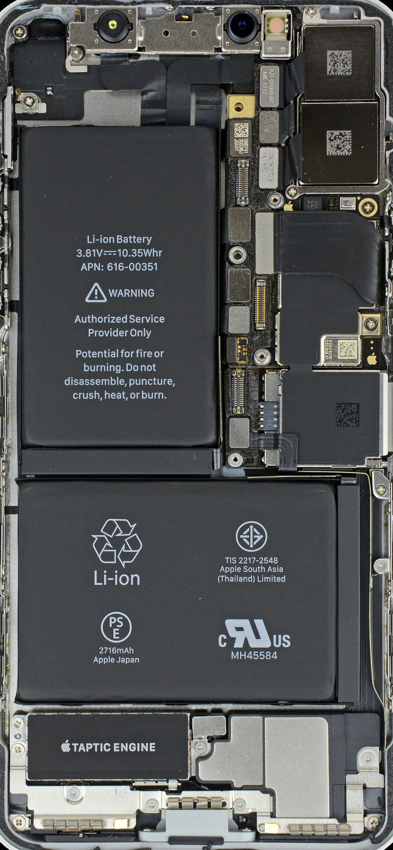 Крупный план мобильного телефона с прикрепленной батареей (ifixit, iphone x)