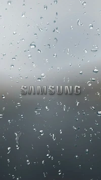 Samsung logo with water droplets on a glass surface.