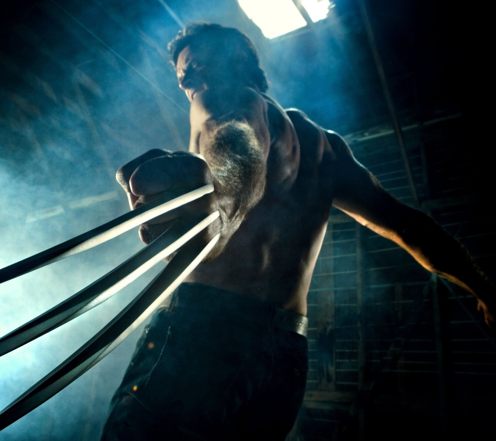 A close up of a man holding two large claws of a wolverine (action, wolverine, x men)