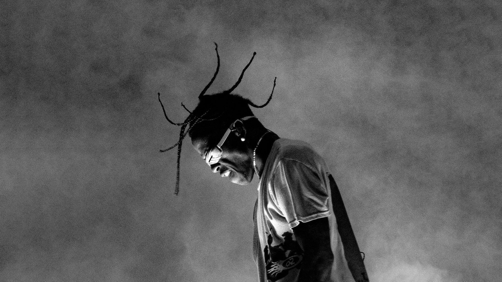 Arafed man with dreads and a skateboard in a black and white photo (travis scott, monochrome, live concert, 5k, black and white)