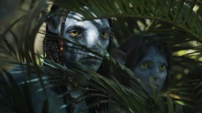 Na'vi characters peering through lush greenery in a scene from "Avatar: The Way of Water" (2022).