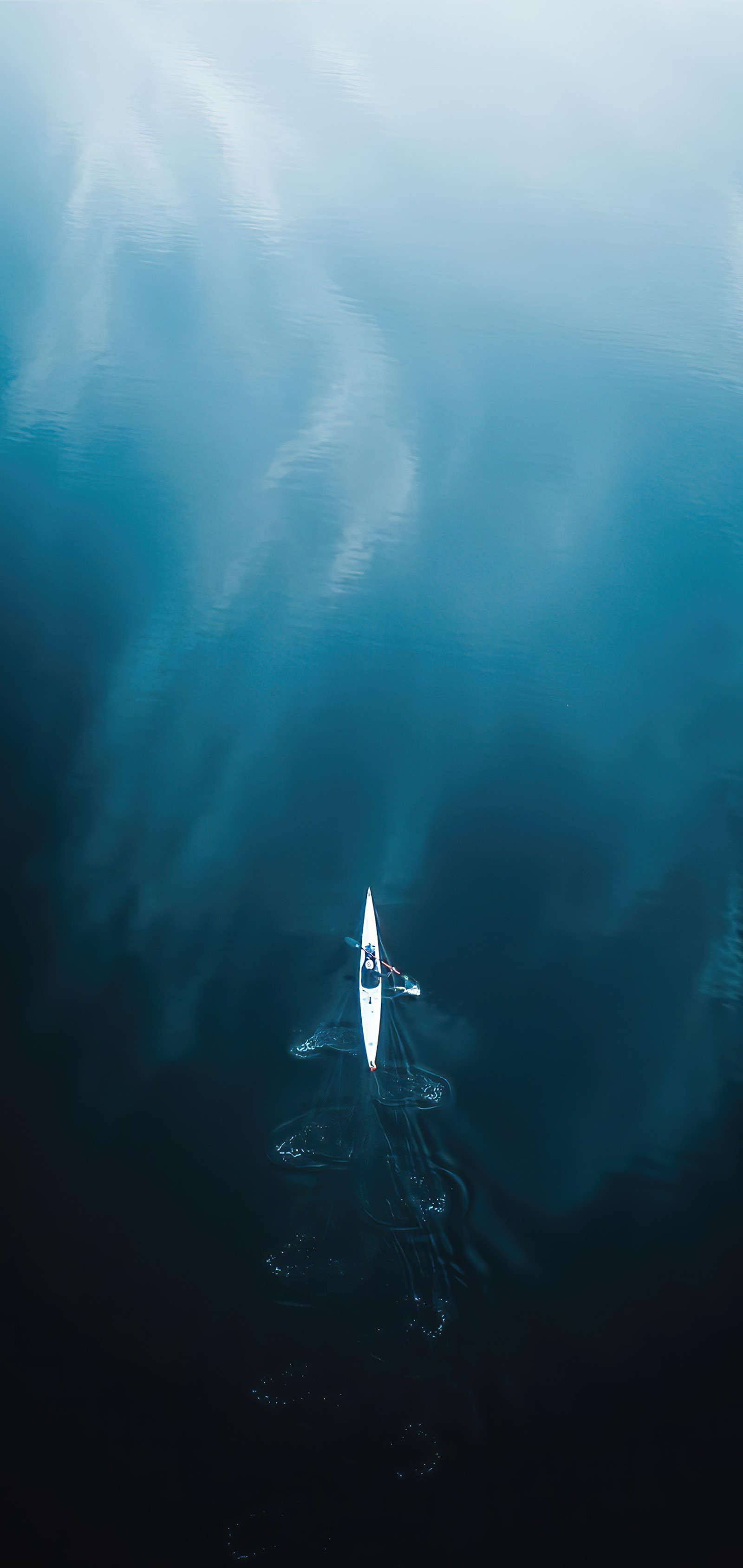 Arafed boat in the middle of a body of water with a sky background (water, atmosphere, liquid, underwater, cloud)