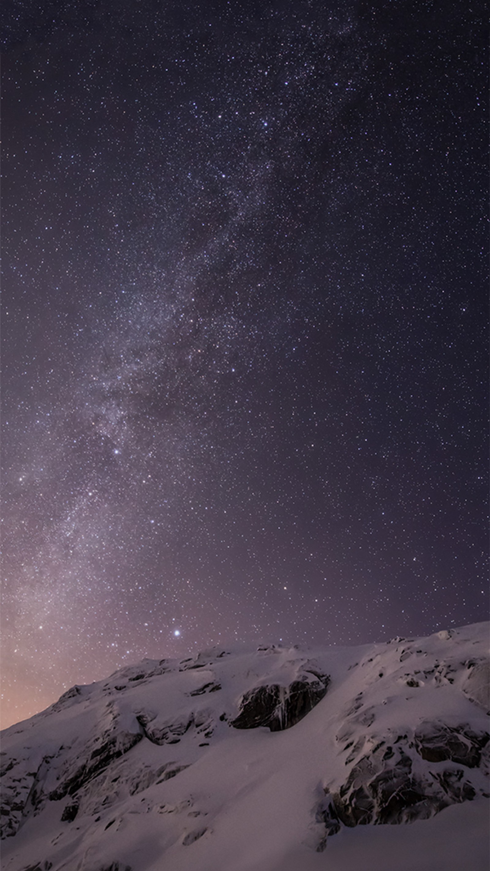 Starry sky over a snowy mountain with a lone person on a snowboard (apple, default, iphone, original, plus)