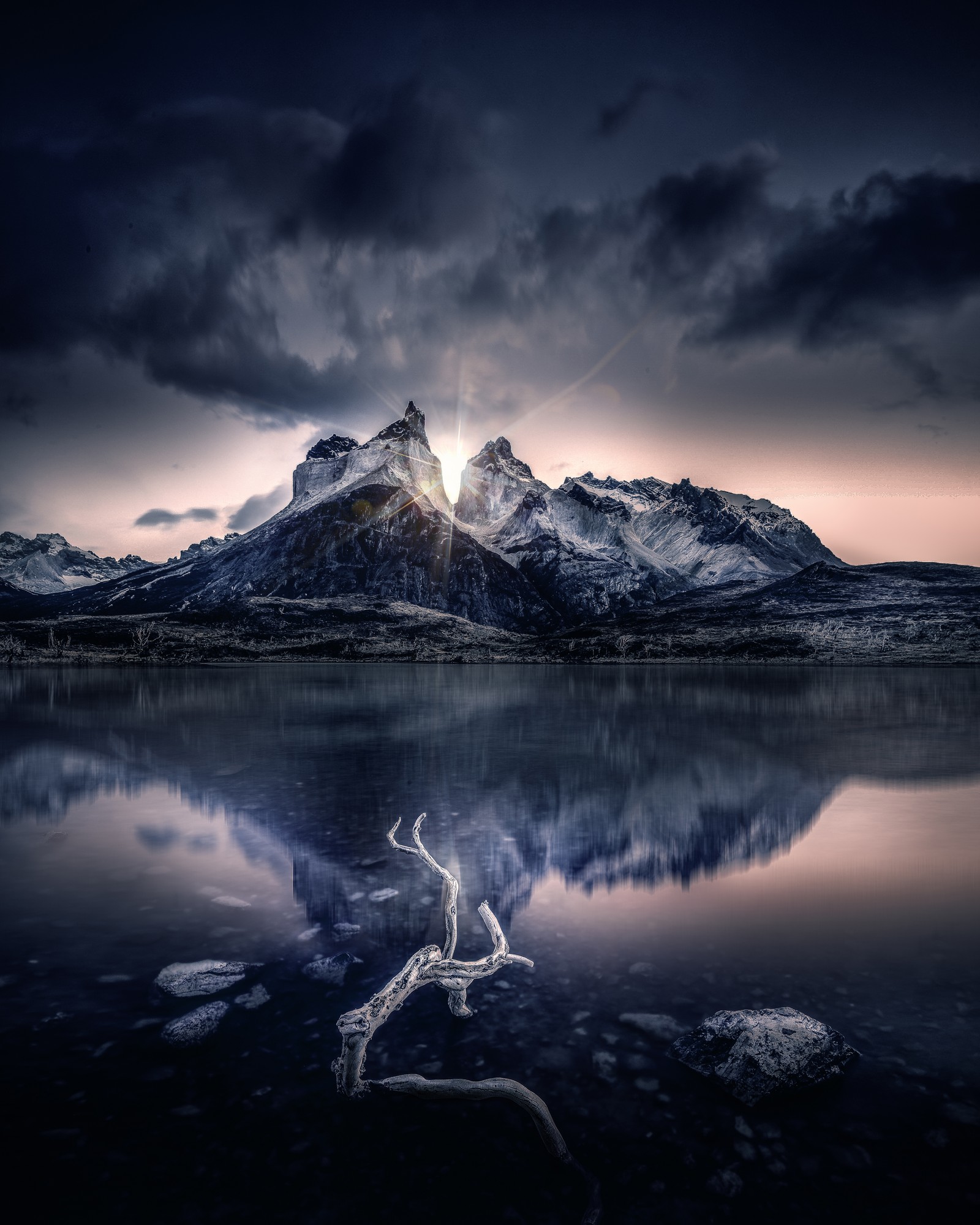 Arafed mountain with a river in the foreground and a cloudy sky (mountain, sunlight, lake, reflection, morning)