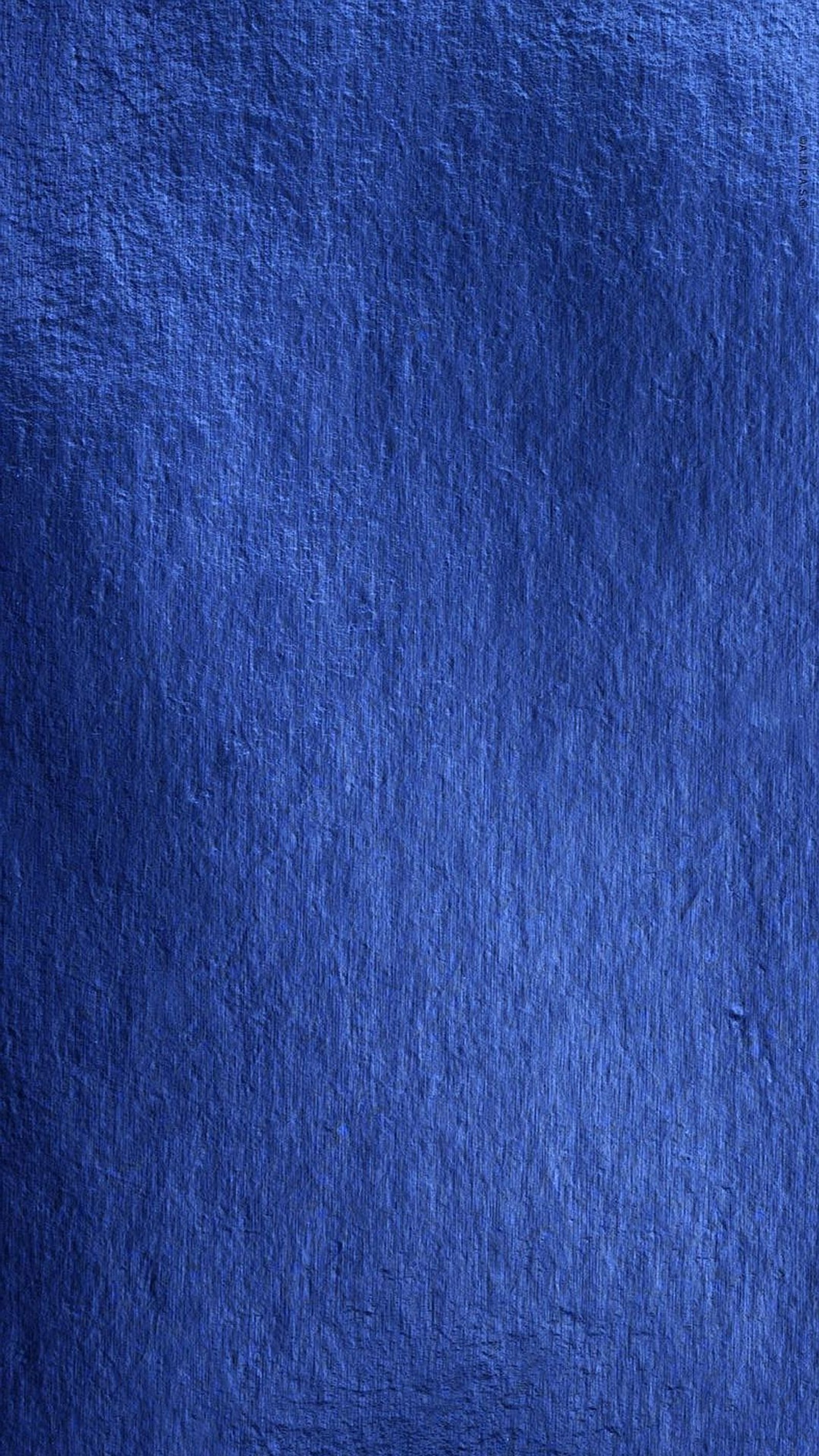 A close up of a blue cloth with a white background (blue, texture)