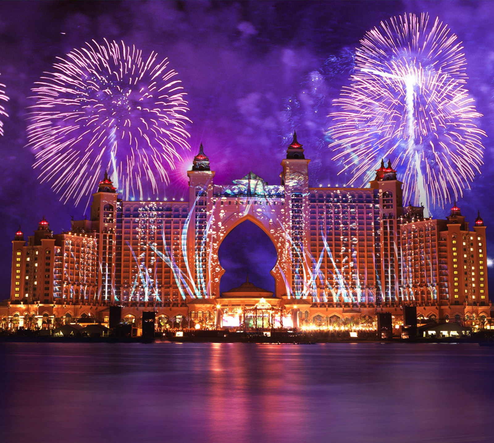 Fireworks illuminate the hotel and surrounding buildings in the night (abstract, fireworks hd)