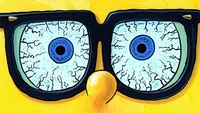 Whimsical Close-Up of Cartoon Glasses with Playful Eyes