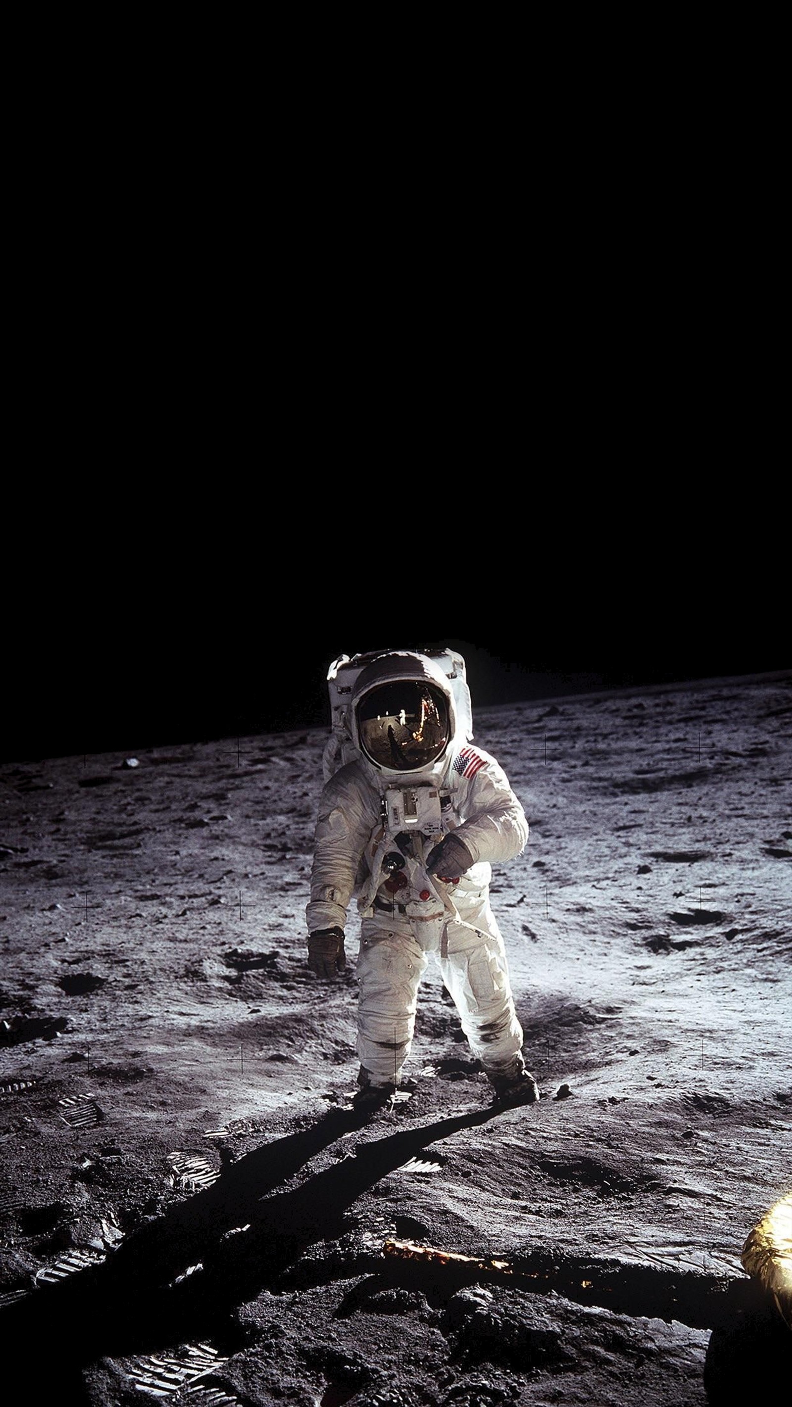 Astronaut walking on the moon with a gold ball in the foreground (astronaut, astronauta, black, galaxy, heaven)