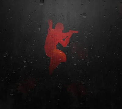 Silhouette of a player in action, featuring a red figure aiming a weapon against a dark, textured background.