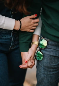 Fashionable Couple Holding Hands