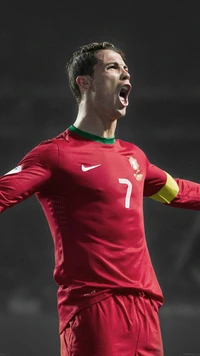 Cristiano Ronaldo celebrating passionately in Portugal's national team jersey.