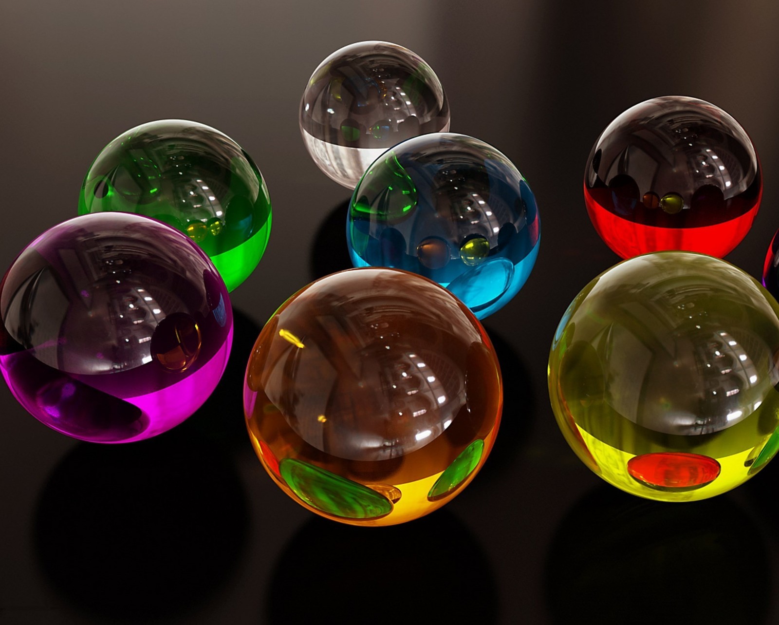 Several glass balls with different colors are sitting on a table (abstract, circle, spheres)