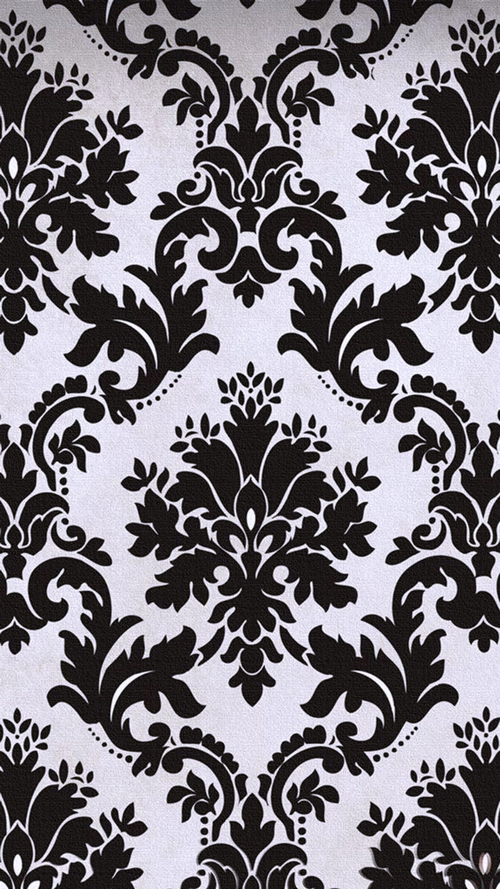 A close up of a black and white wallpaper with a pattern (abstract, black, pattern, white)