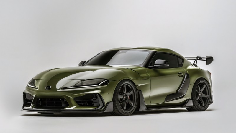 Зеленый спортивный автомобиль на показе в студии (adro toyota gr supra mk5, 5k, тойота гр супра, машины, обои 4k)