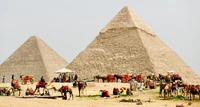 Ancient Pyramids of Giza: A Timeless Landmark Surrounded by Camels and Tourists