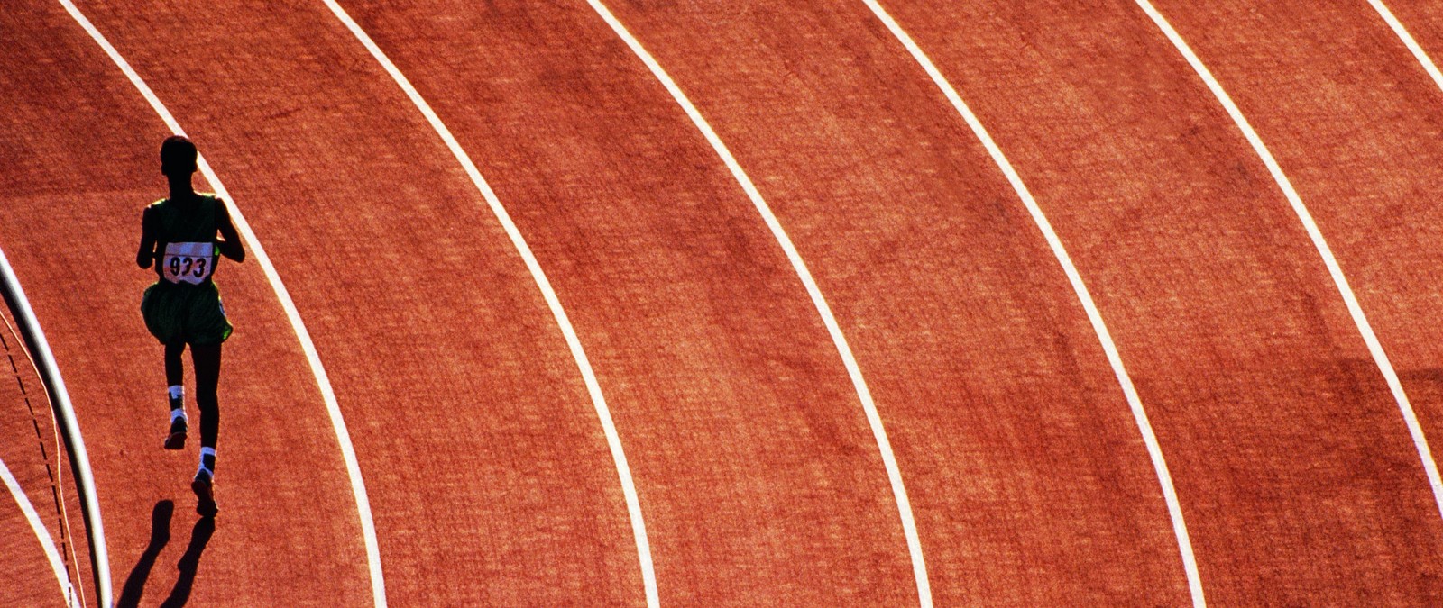 Arafed male athlete running on a track with a red background (running, sprint, wood, line, athletics)