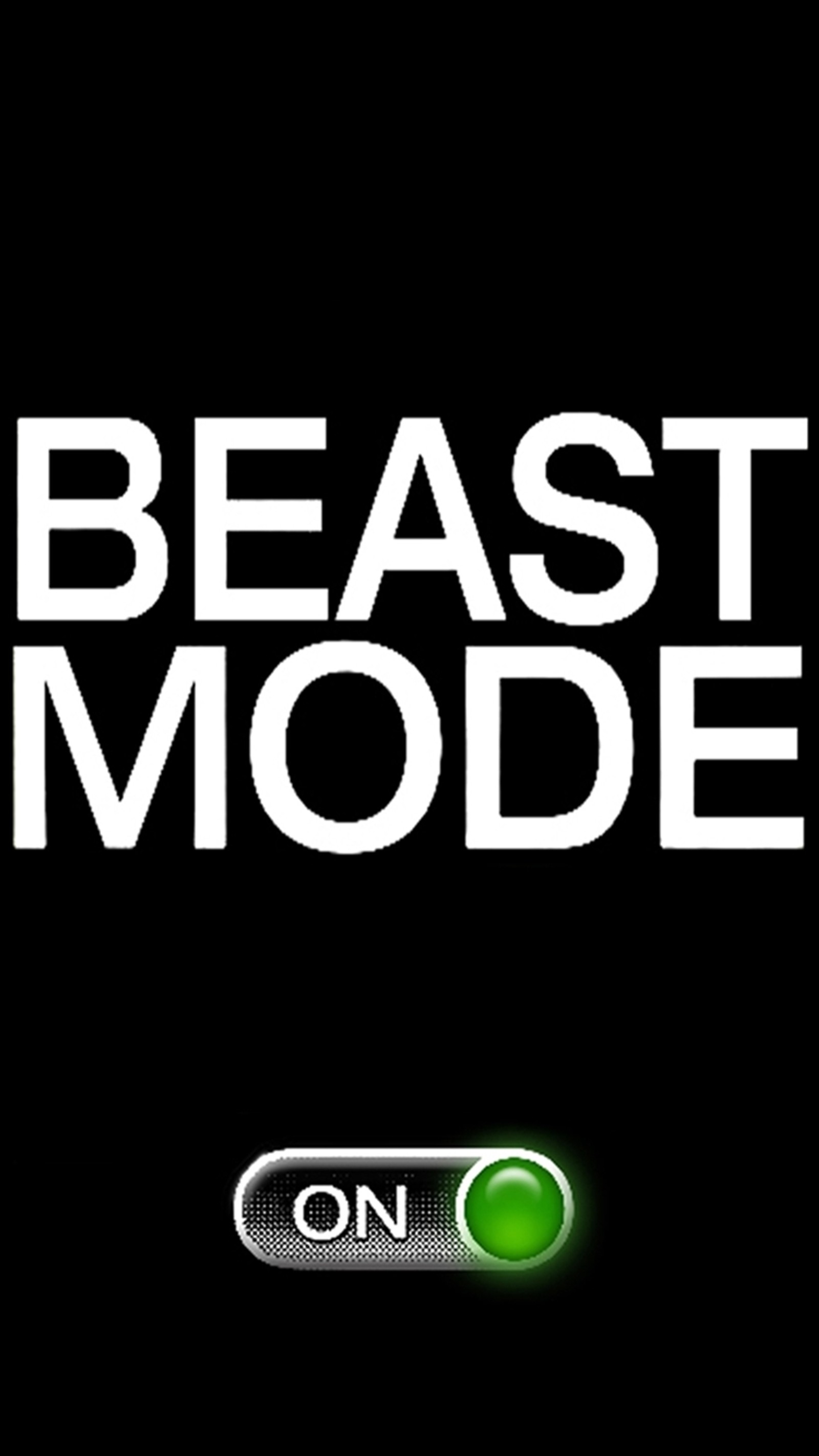 A close up of a button on a black background with the words beast mode (beast, mode, motto, sign)