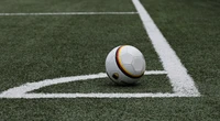 Soccer Ball Positioned at the Corner of an Artificial Turf Pitch