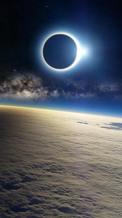 Celestial Eclipse Over a Cloudy Horizon