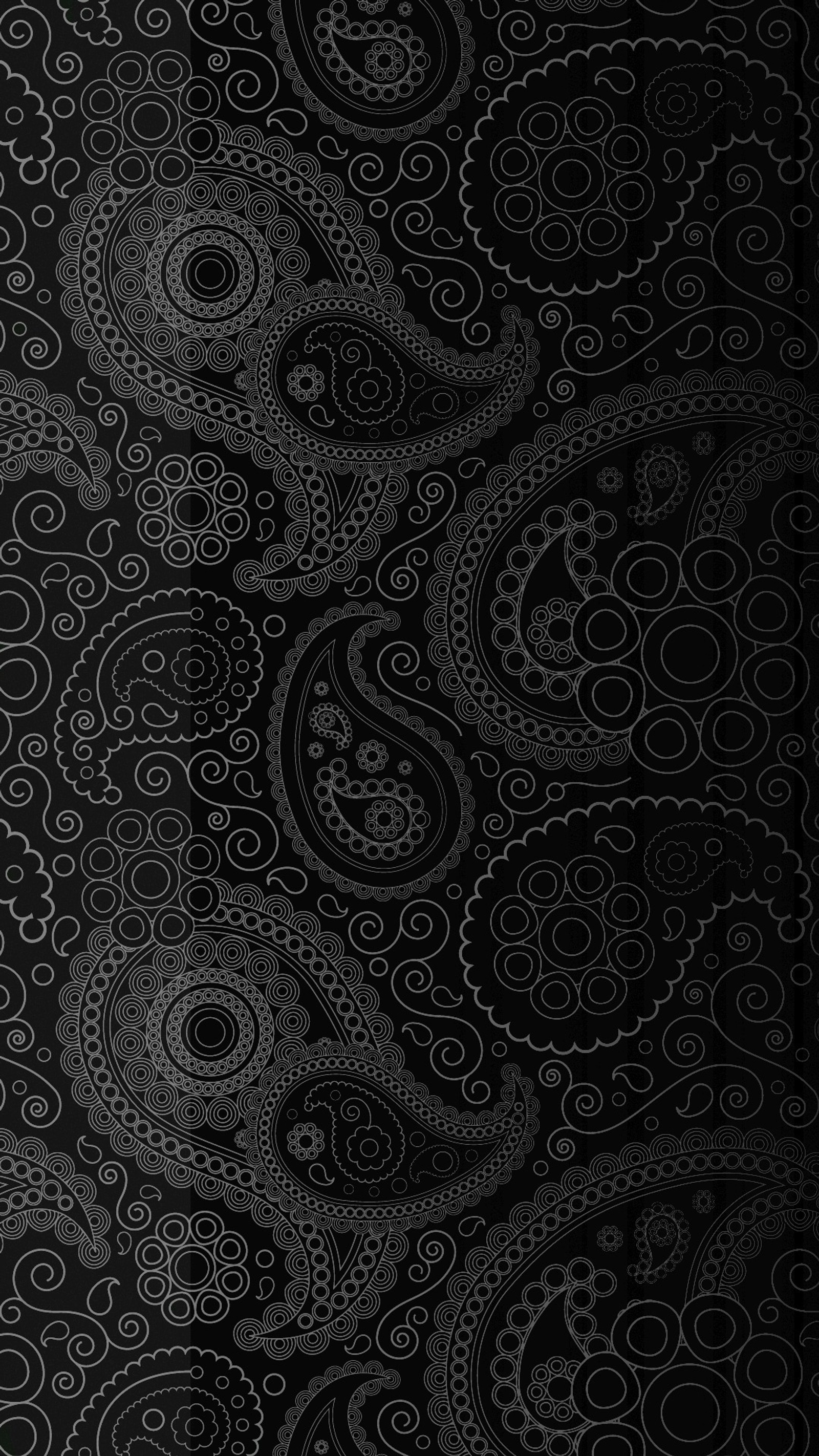 A close up of a black and white paisley pattern on a black background (black, pattern, white)