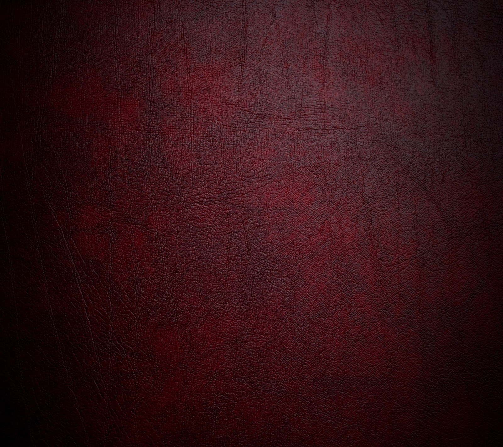 A close up of a red leather texture with a black background (abstract, fabric, leather, red, texture)