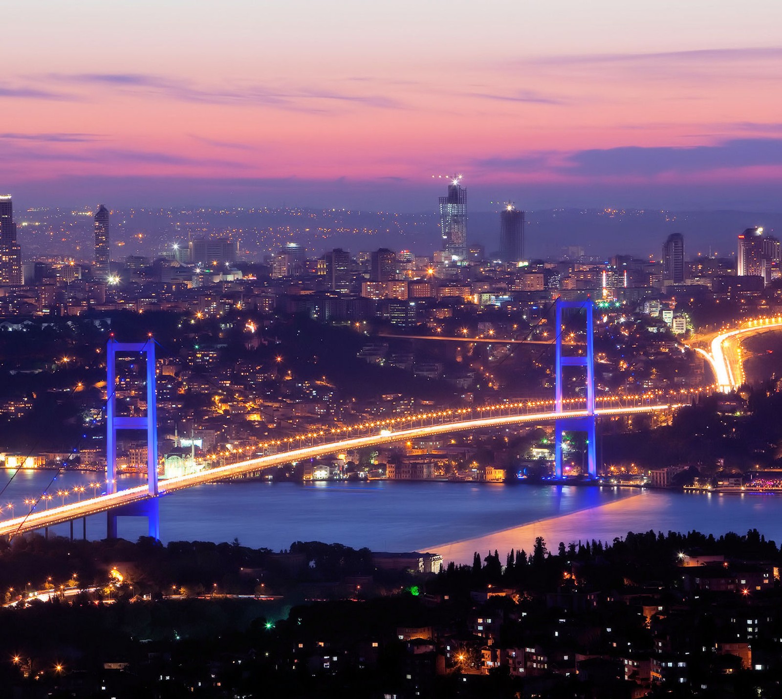 A view of a bridge over a river with a city in the background (bogaz, istanbul, turkey, turkiye)