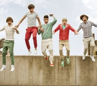 One Direction Boys Joyfully Jumping Together