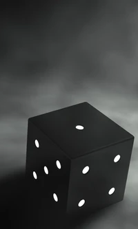 Black Dice with White Dots Against a Dark Background