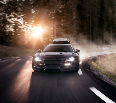 Audi R8 elegante navegando por uma estrada sinuosa ao pôr do sol.