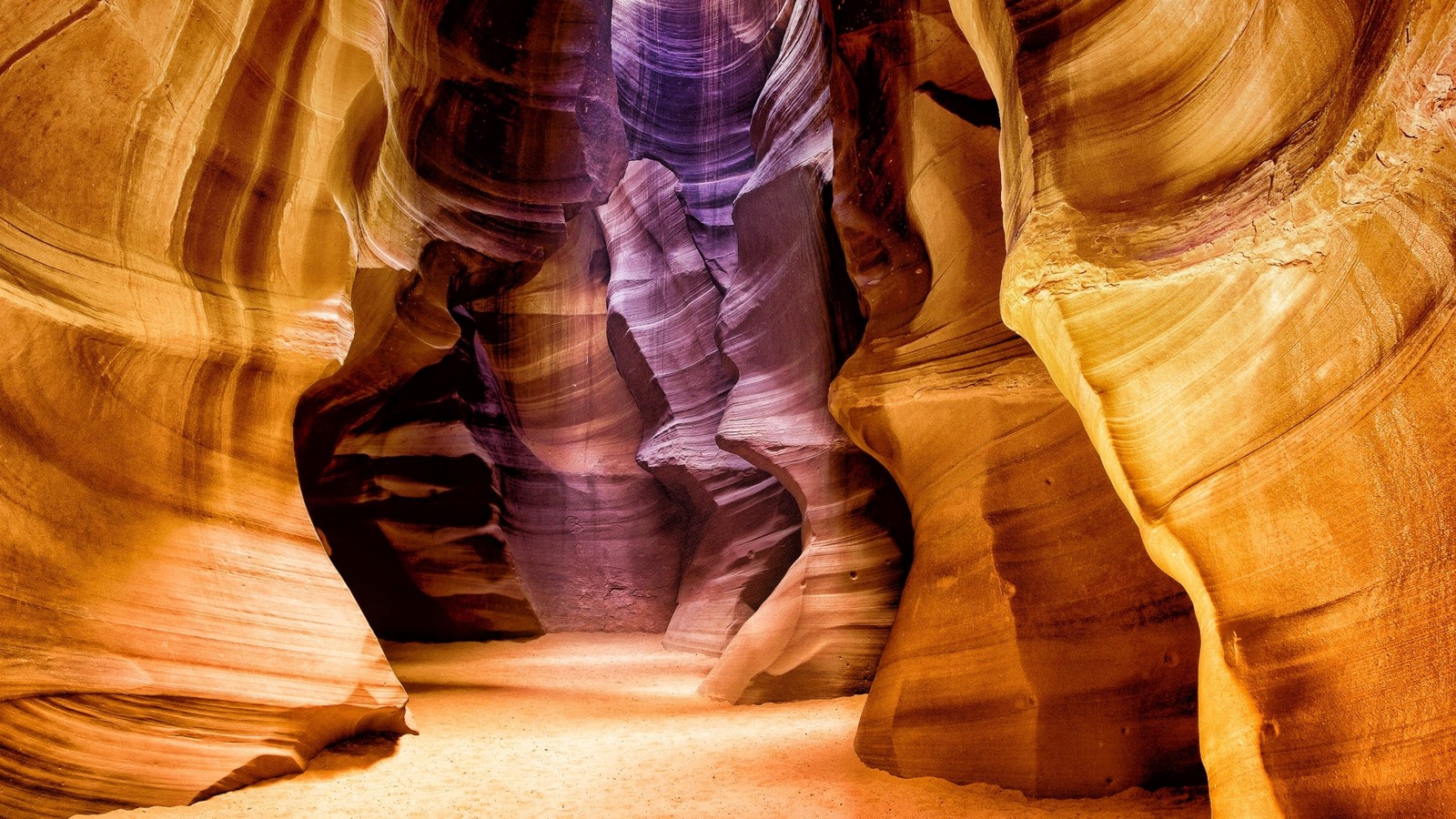 A close up of a narrow canyon with a light at the end (canyon, zion national park, girl, page, grand canyon)