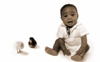 Joyful Infant Sitting with Adorable Chicks