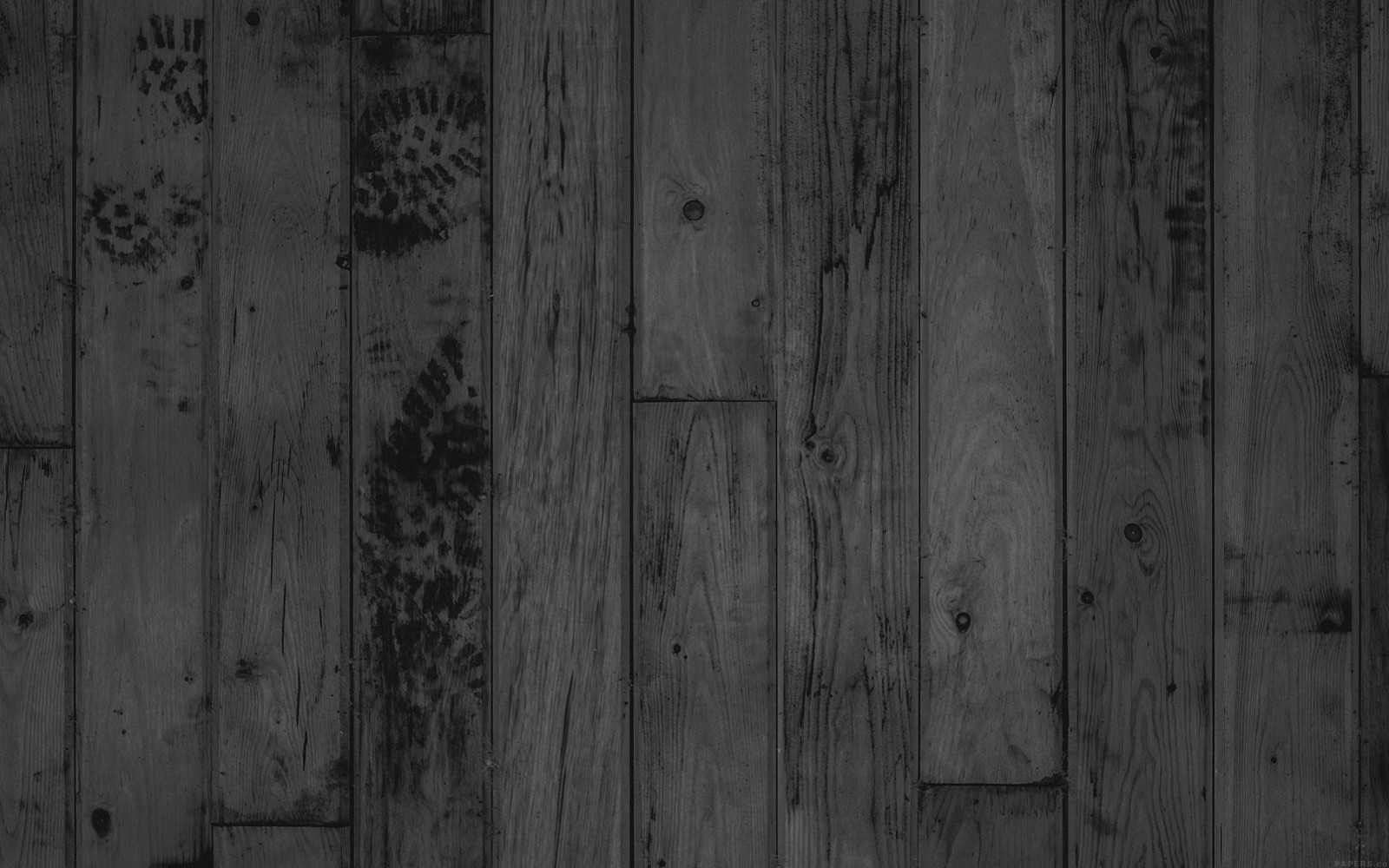 A close up of a black and white photo of a wood floor (wood, black, hardwood, plank, wood flooring)