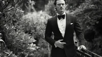 Elegant Gentleman in Formal Wear Amidst Lush Greenery - Monochrome Photography