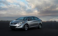 Sleek Hyundai Compact Sedan Against a Dramatic Sky