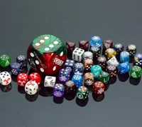 Assorted Colorful Dice on a Reflective Surface