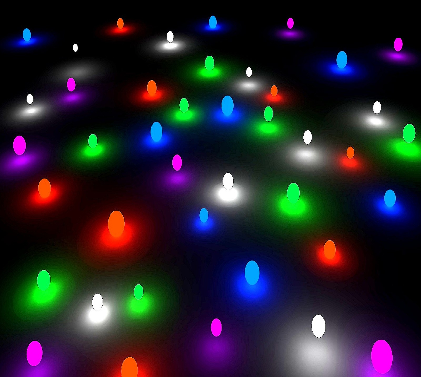 A close up of a bunch of lights that are on a floor (the colored balls)