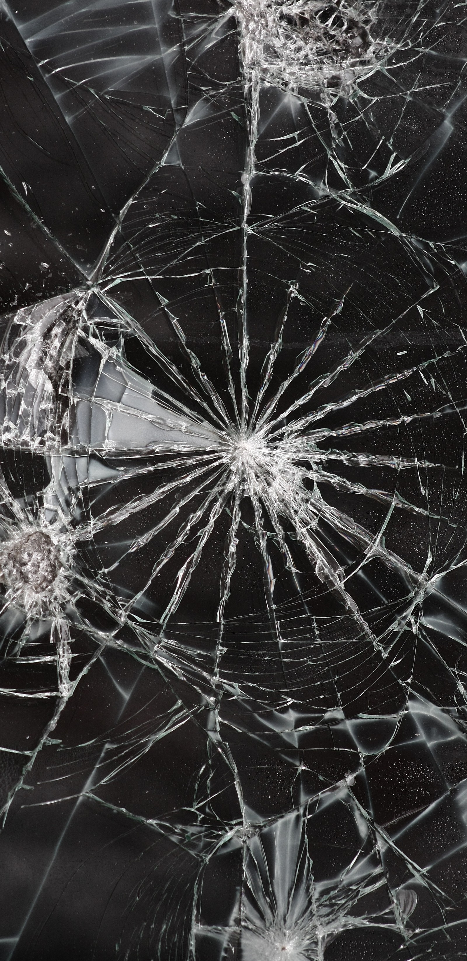 A close up of a broken glass window with a broken glass (broken, glass, screen)